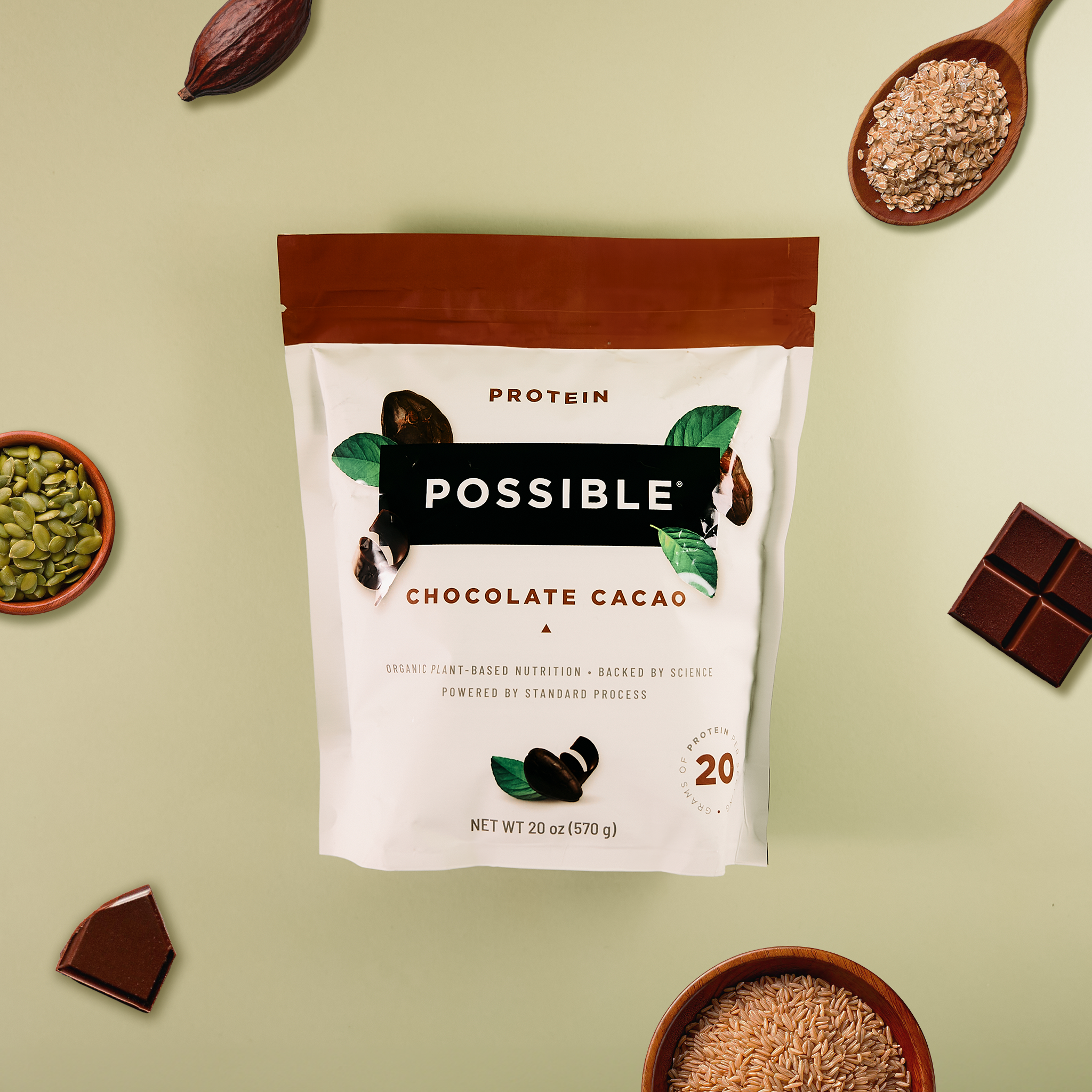 Protein powder package with 'Possible' branding on a light green background with chocolate and cacao ingredients.