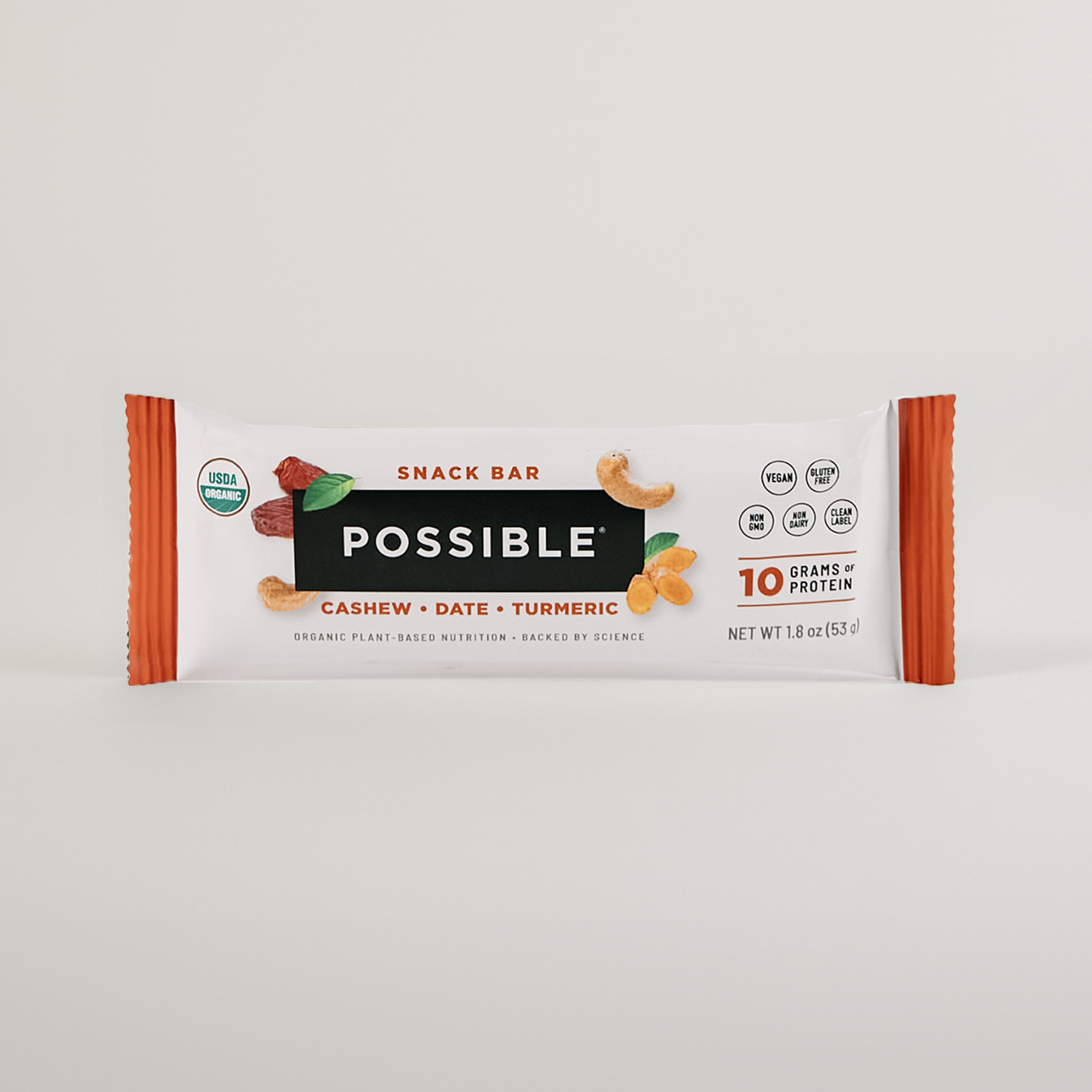 POSSIBLE Cashew Date Turmeric Snack Bar in packaging, emphasizing organic, non-GMO, and 10 grams of plant-based protein benefits.