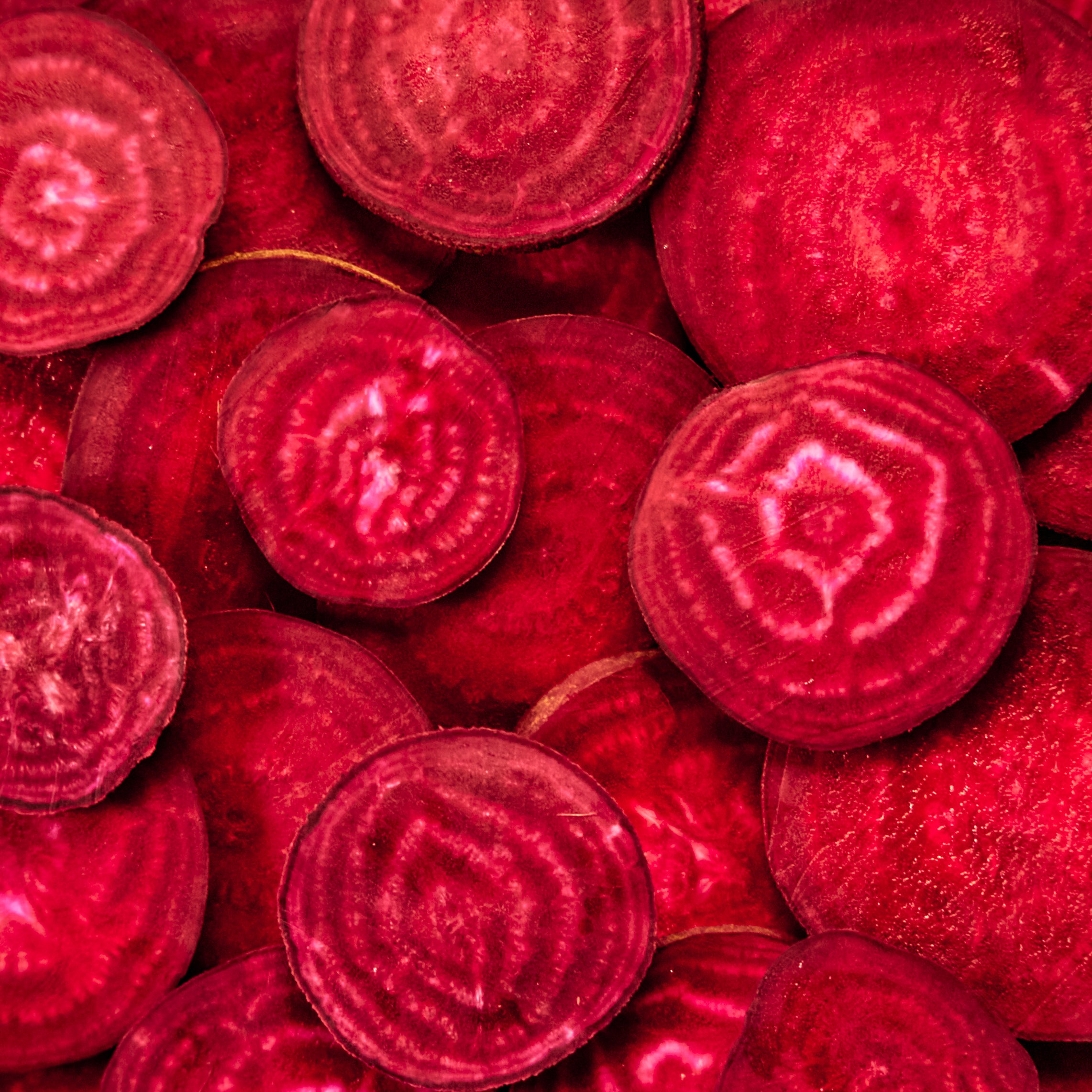 POSSIBLE Close-up of sliced beets, a core ingredient in POSSIBLE Strawberry Beet Almond Snack Bar, known for its natural energy-boosting and nutrient-rich properties.