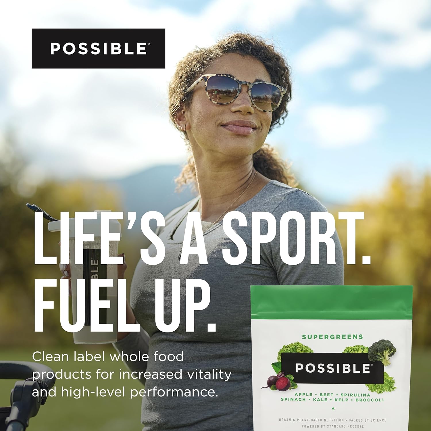 Woman holding a sports drink with 'Possible' supergreens package and text 'Life's a Sport. Fuel Up.'
